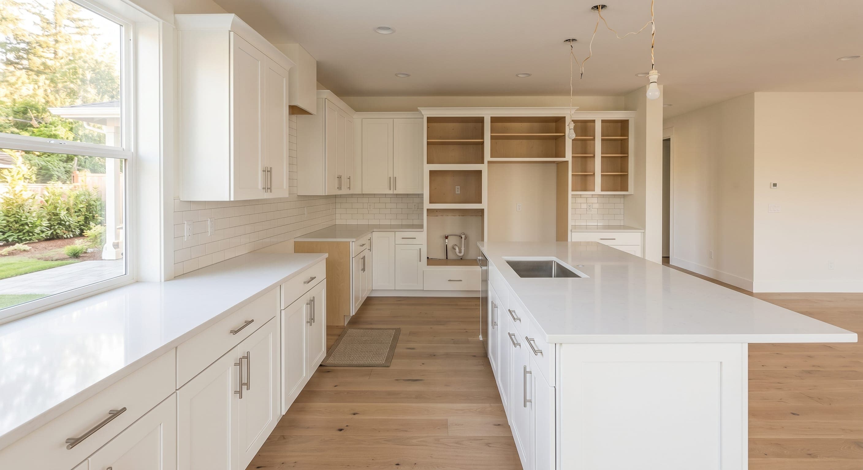 Vacant kitchen after post-construction cleaning with dust and debris removed